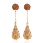 Chokore Hoops with turquoise blue glass droplets. Gold tone. Bamboo Rattan Woven Lantern Drop earrings. Gold tone.